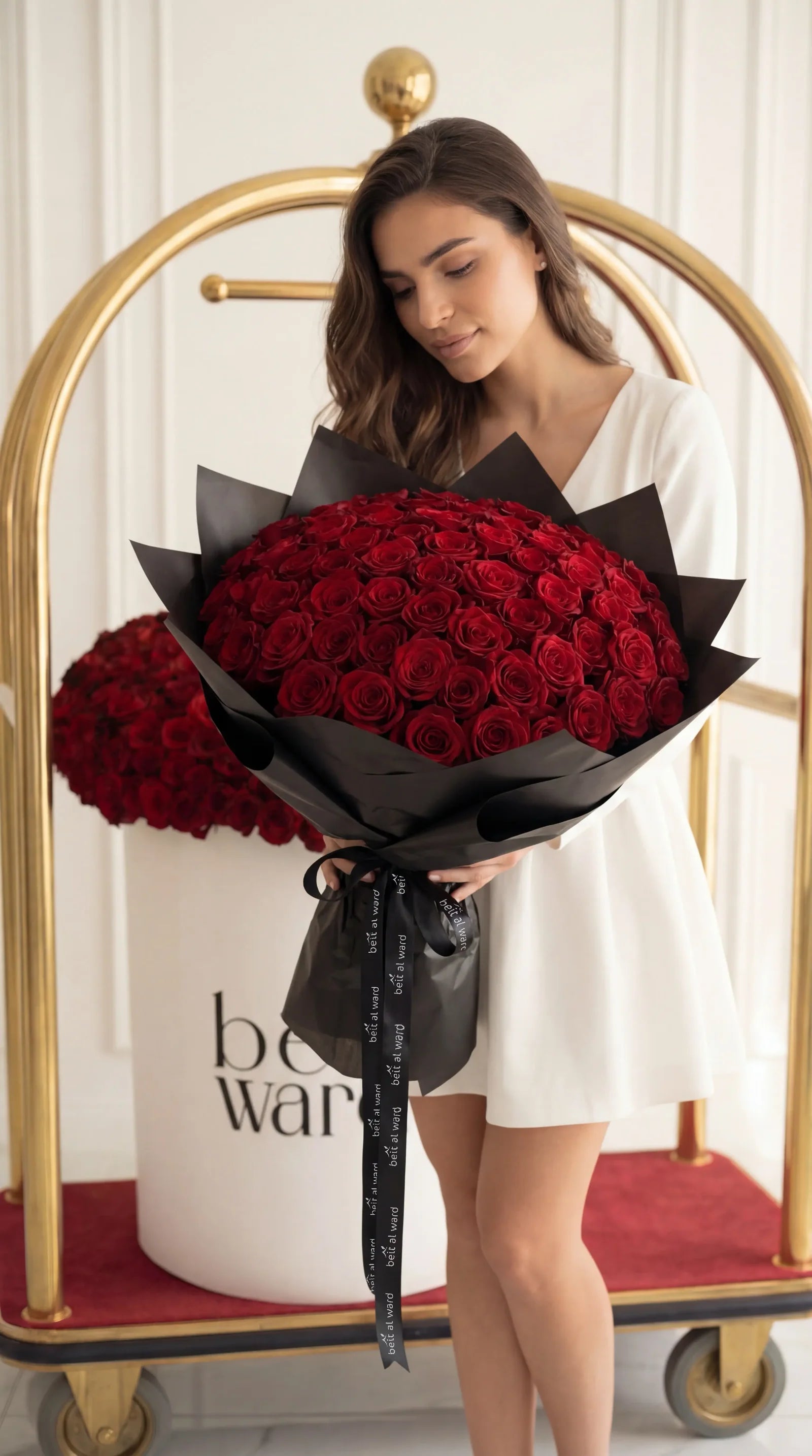 100 red roses luxury bouquet wrapped in black paper Lebanon by Beit El Ward