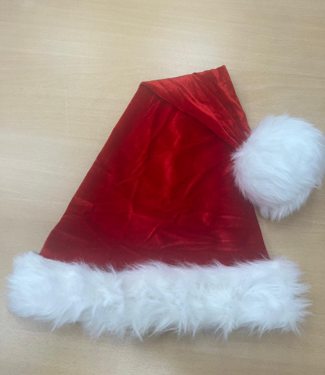 Red Santa hat with white plush trim and pompom