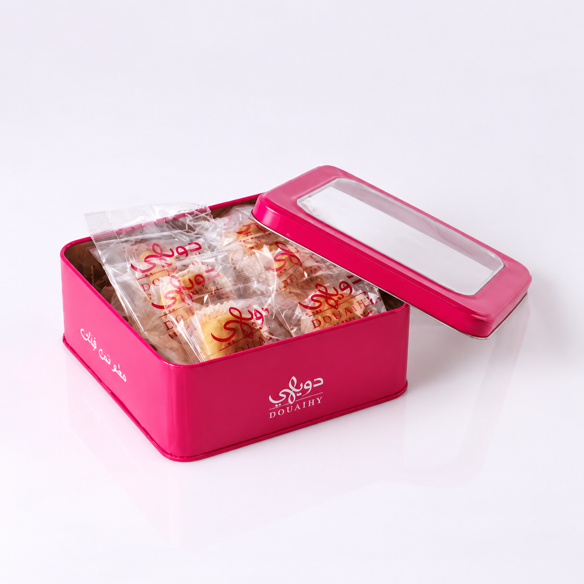 Douaihy Maamoul Dates Packed ~ 15pcs. Individually wrapped date maamoul in an open pink tin.