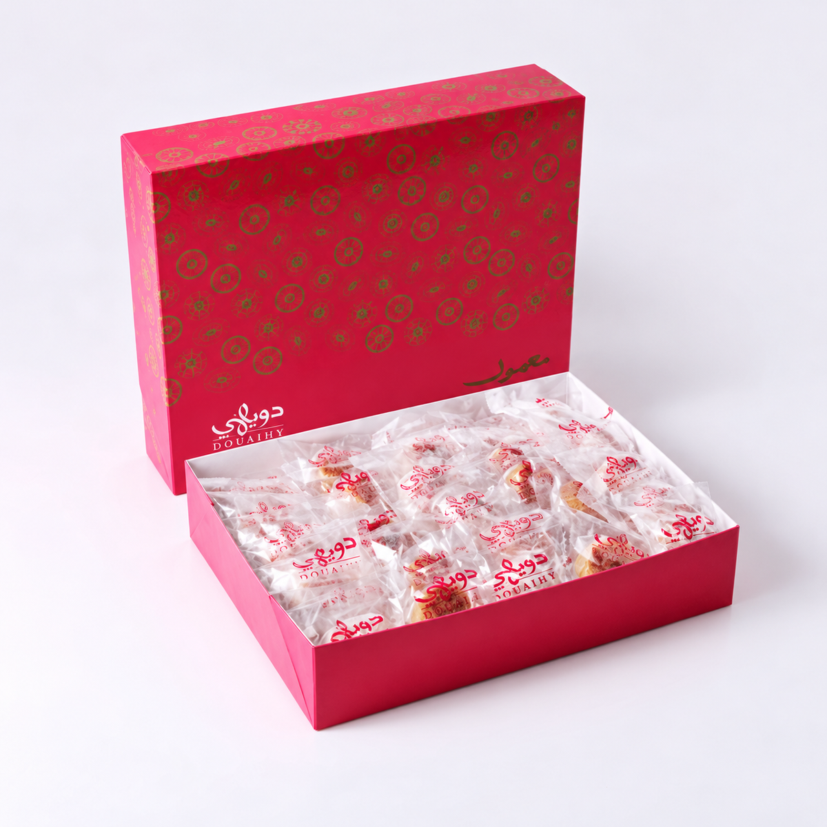 Douaihy Maamoul Packed ~ 50pcs. Individually wrapped maamoul in an open pink patterned gift box.