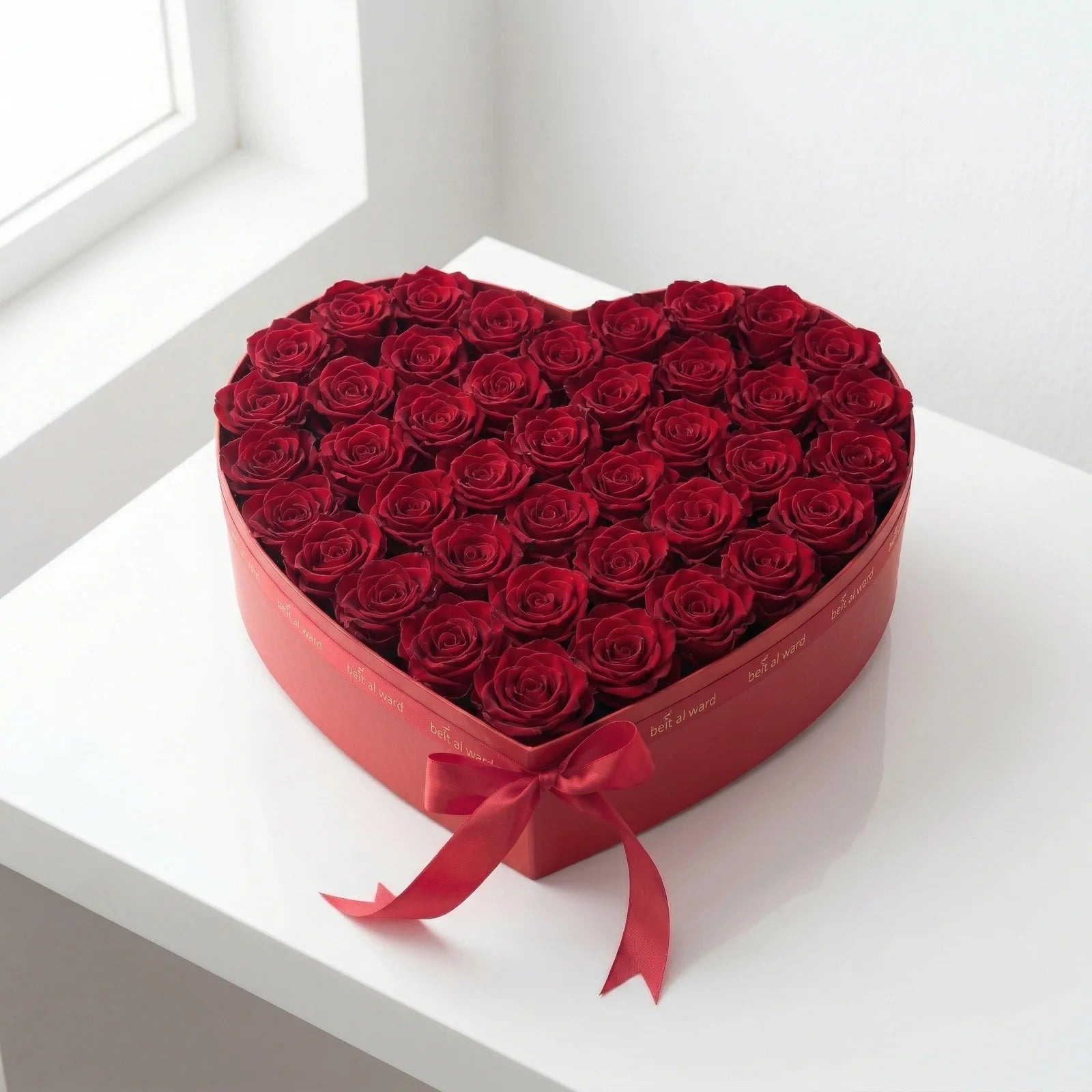 Heart-shaped box with 35 red roses arrangement by Beit El Ward Lebanon