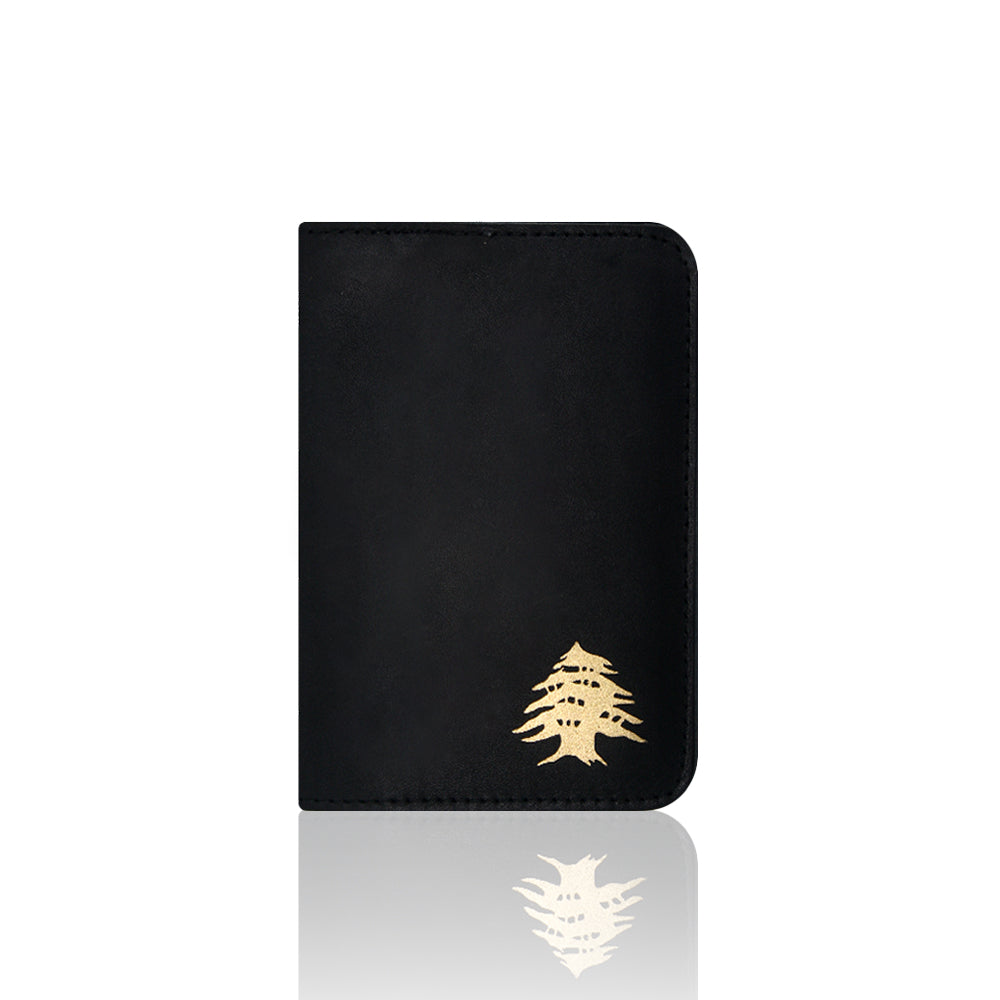 Muftah El Chark real leather black passport cover with gold cedar emblem, luxury Lebanese travel accessory.
