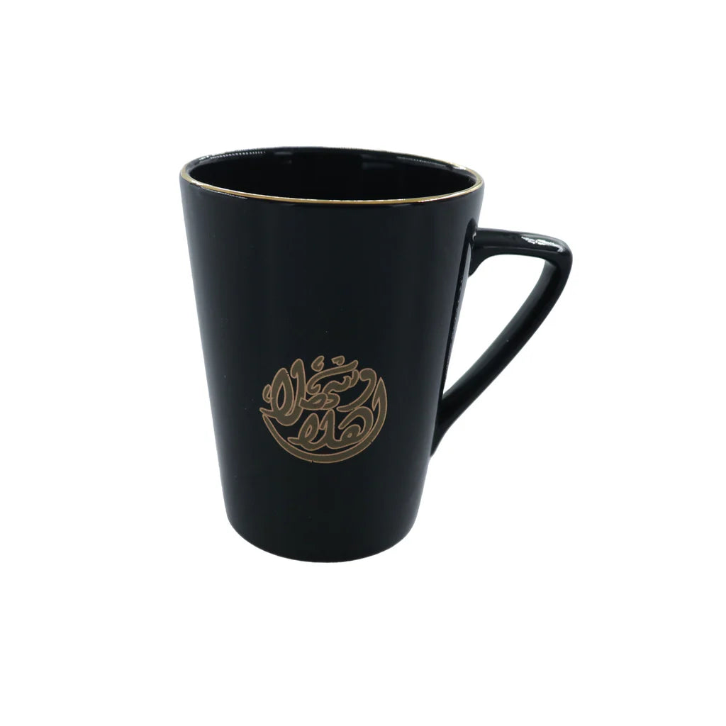 Black porcelain mug featuring Ahlan Wa Sahlan Arabic typography with elegant gold detailing