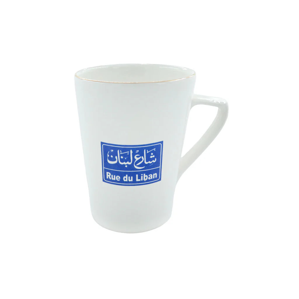 White porcelain mug featuring Rue Du Liban street sign inspired artwork
