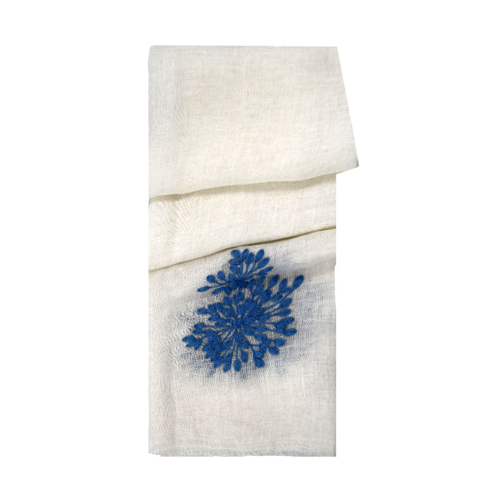 White linen scarf with blue floral detail by Mouftah El Chark, elegant minimalist summer accessory at Idole Lebanon