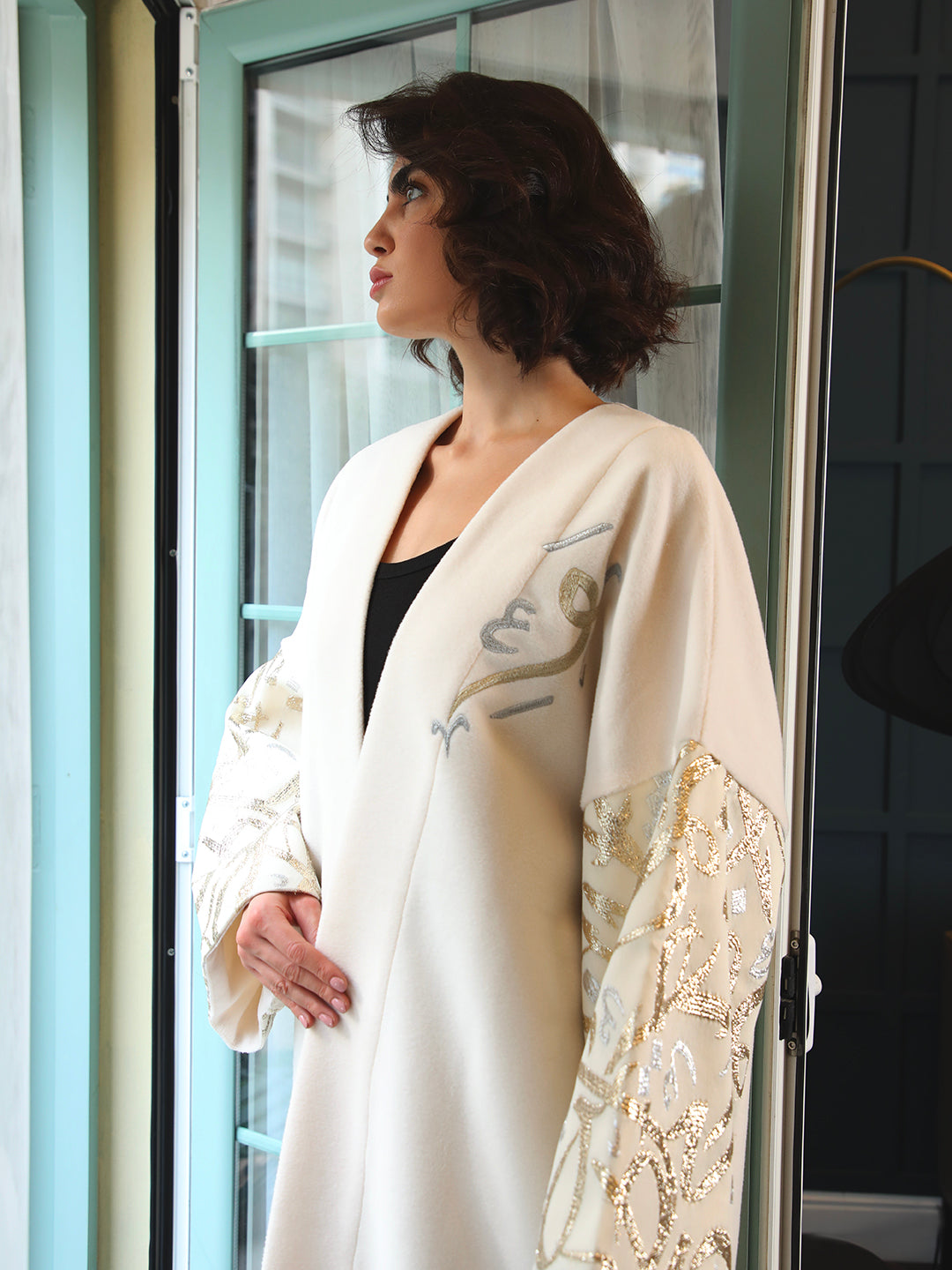 White abaya with embroidered sleeves by Mouftah El Chark, elegant and comfortable modest wear for women at Idole Lebanon