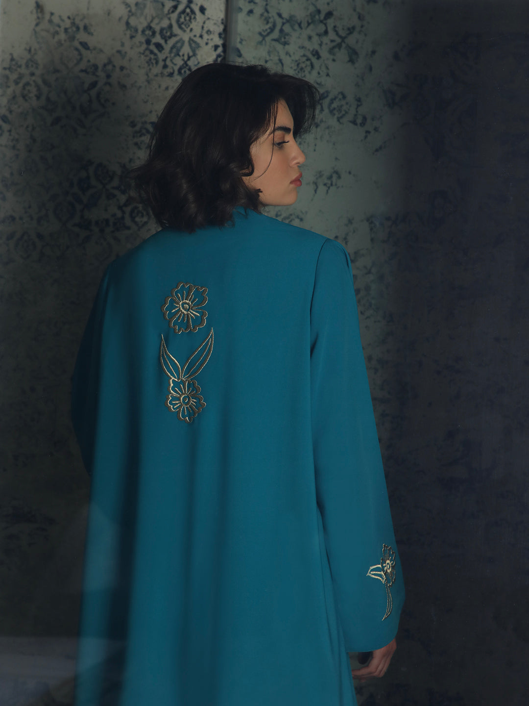 Teal abaya with gold floral embroidery and long sleeves by Mouftah El Chark, elegant modest wear for women at Idole Lebanon
