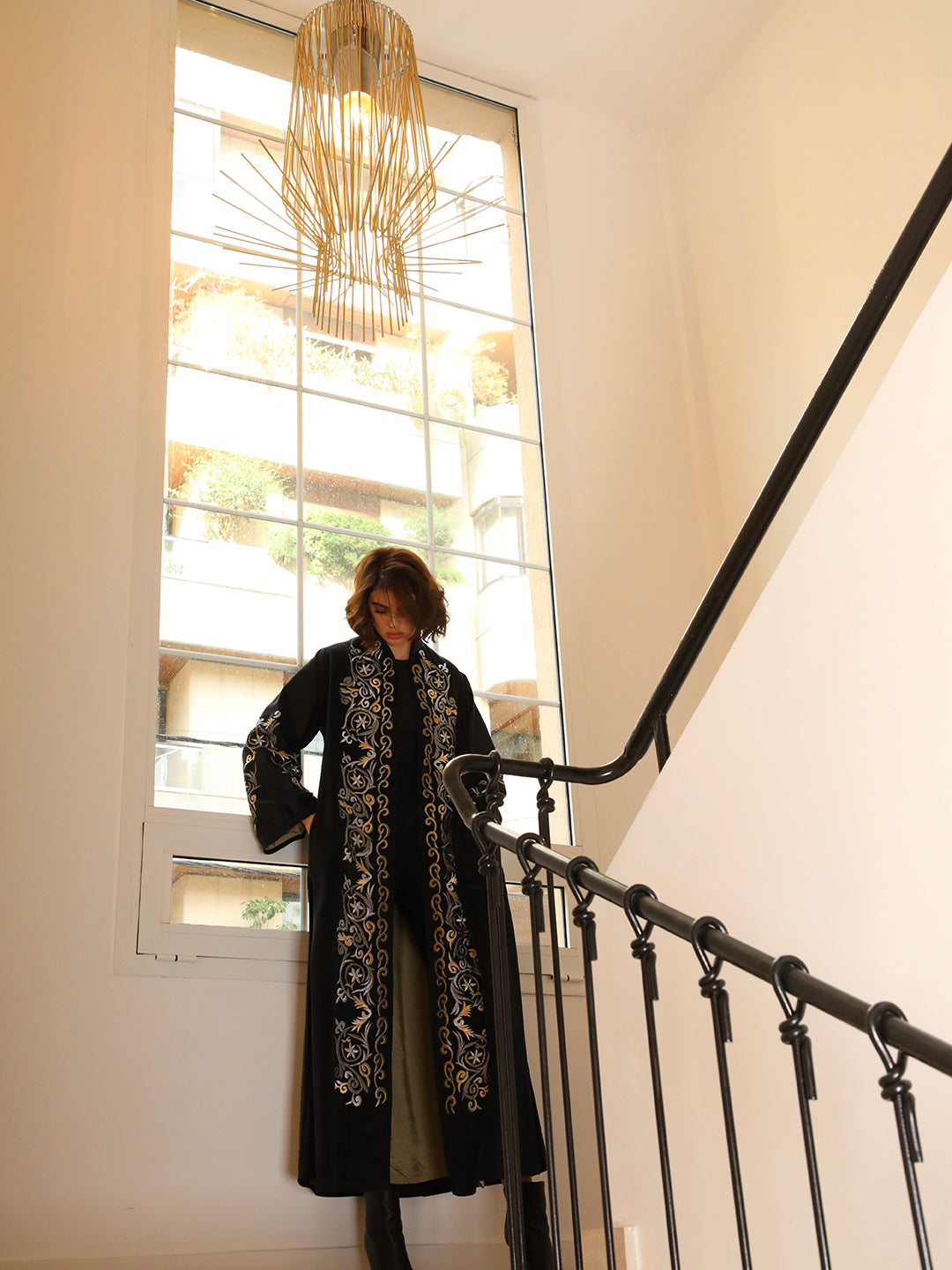 Black velvet abaya with gold floral embroidery by Mouftah El Chark, luxury modest wear for women at Idole Lebanon