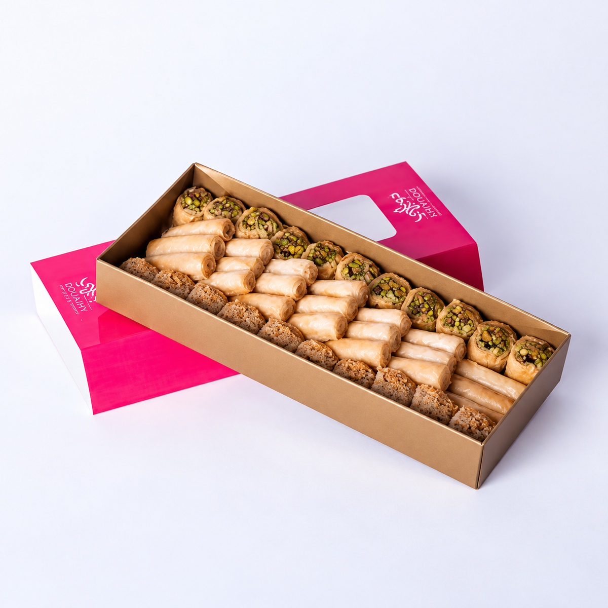 Douaihy Sweets Bar ~ 40pcs. Assorted pastries in a long gold tray with pink sleeve.