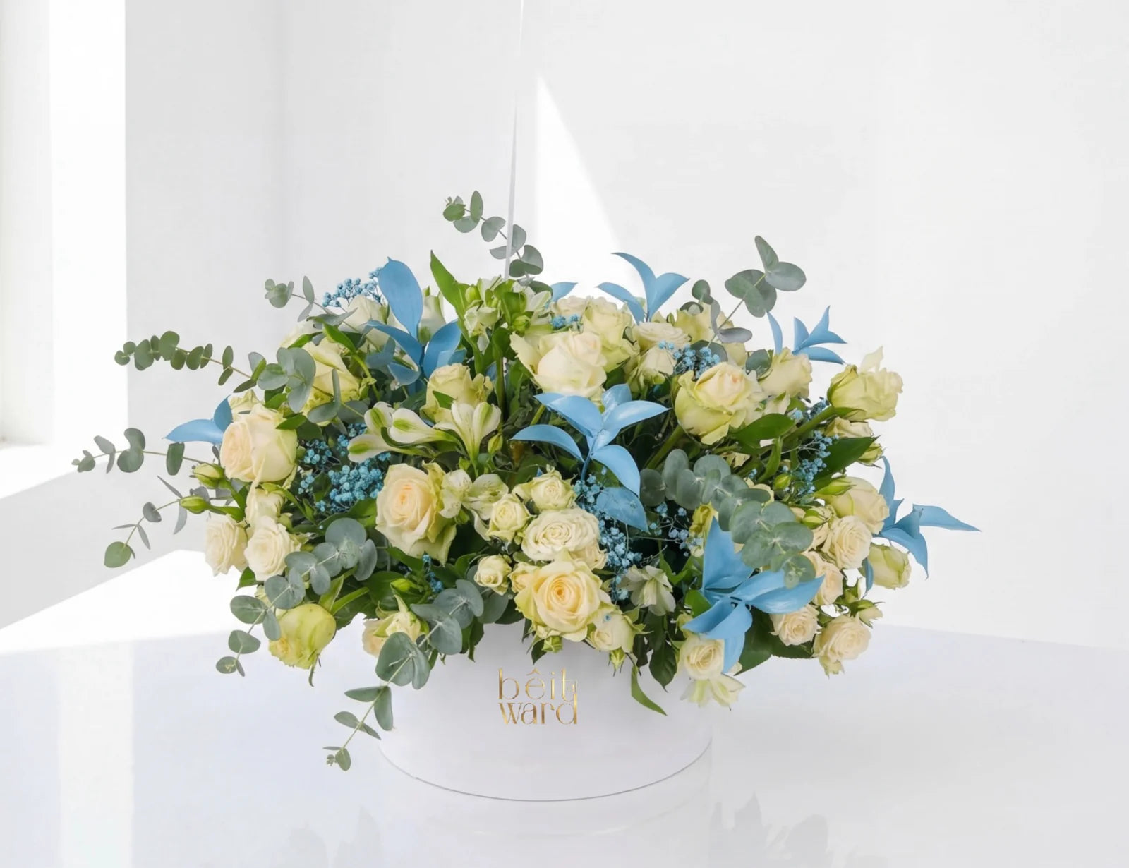 White and blue flower box arrangement with greenery Beirut Lebanon