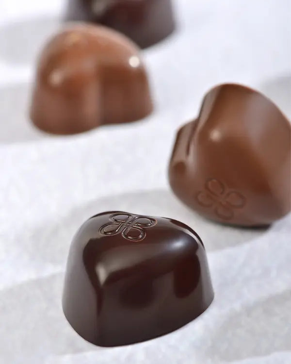 Close-up of Patchi heart-shaped chocolates with praliné and crêpe fillings
