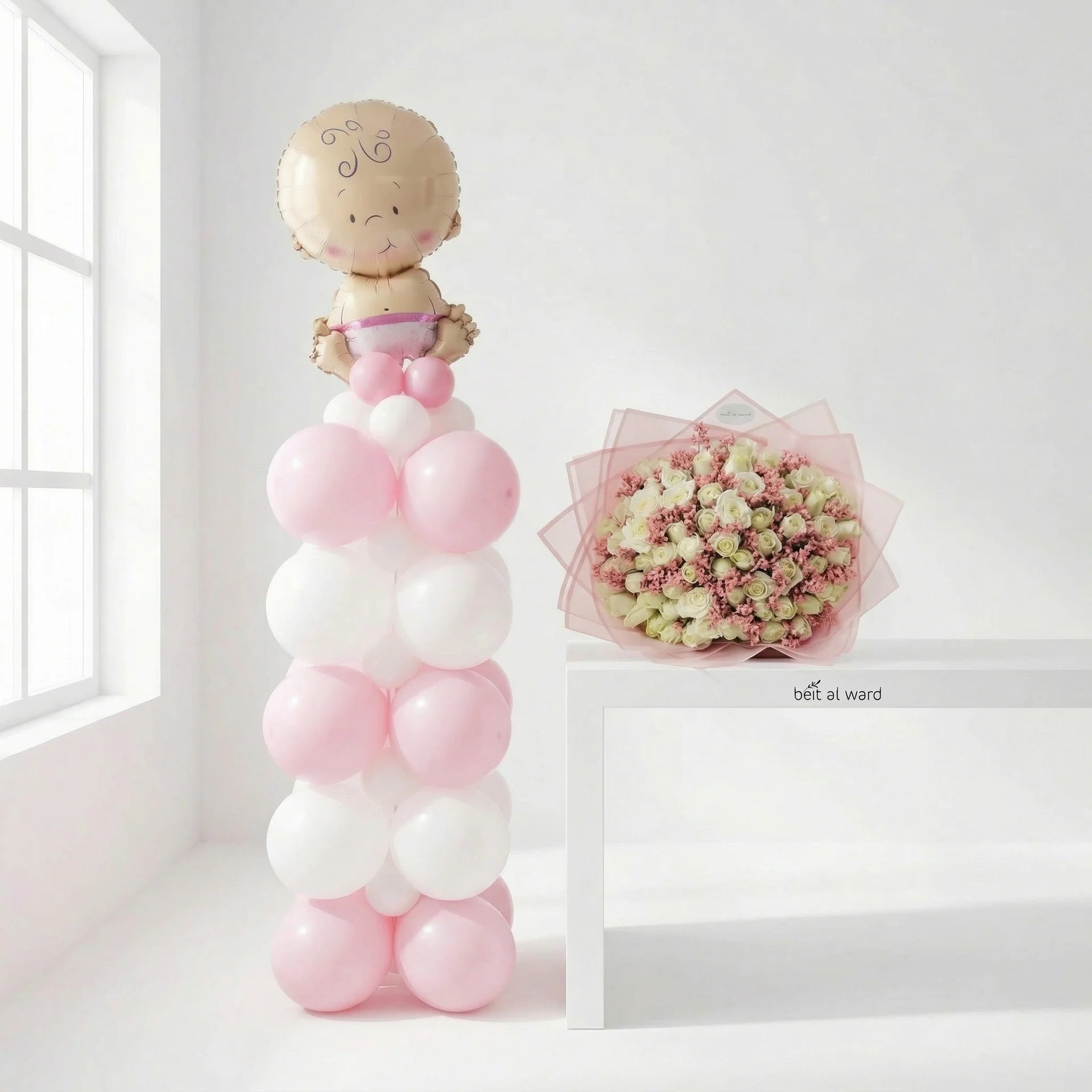 Hello Baby Girl celebration set with pink balloon stand and flower bouquet for newborn delivery in Lebanon by Idole Lebanon