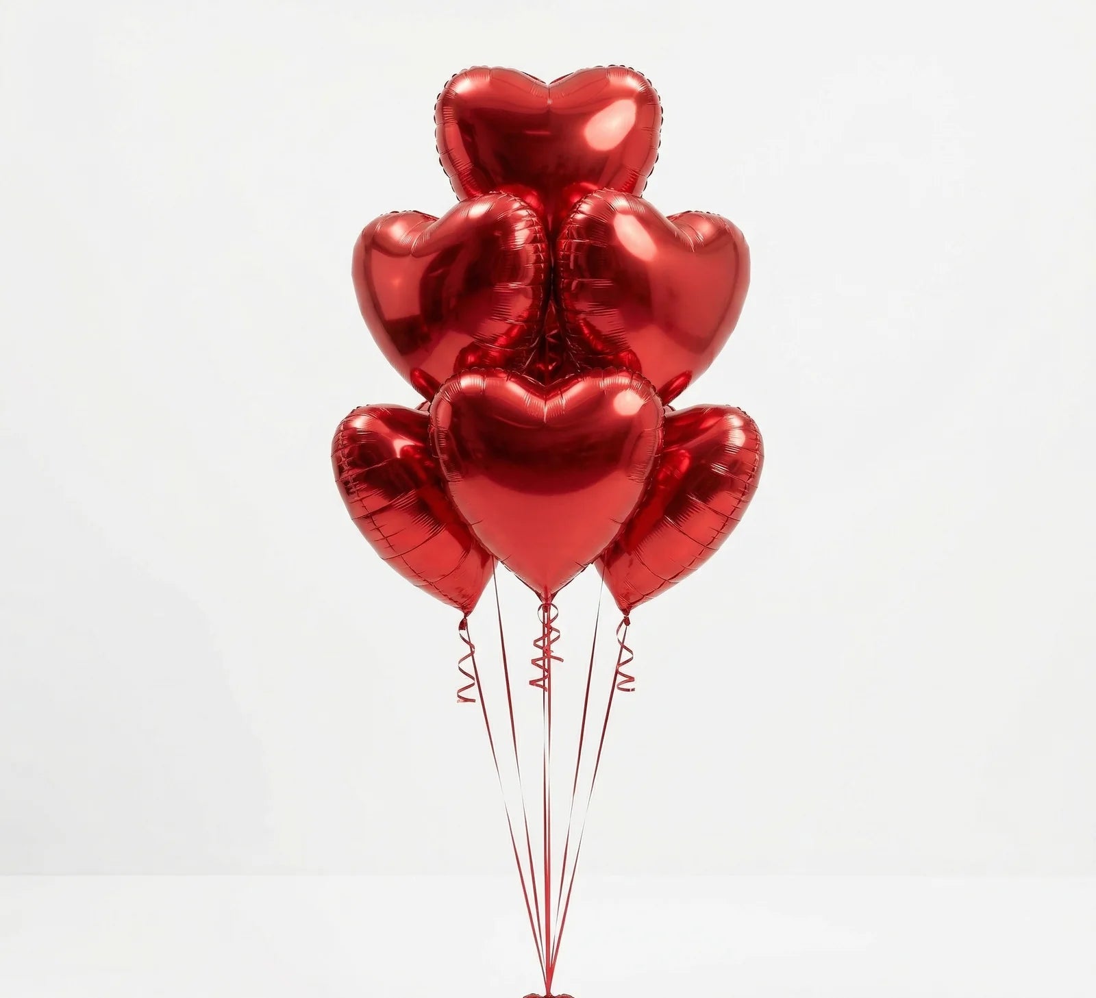 Red heart shaped helium balloons bouquet for romantic celebrations in Lebanon