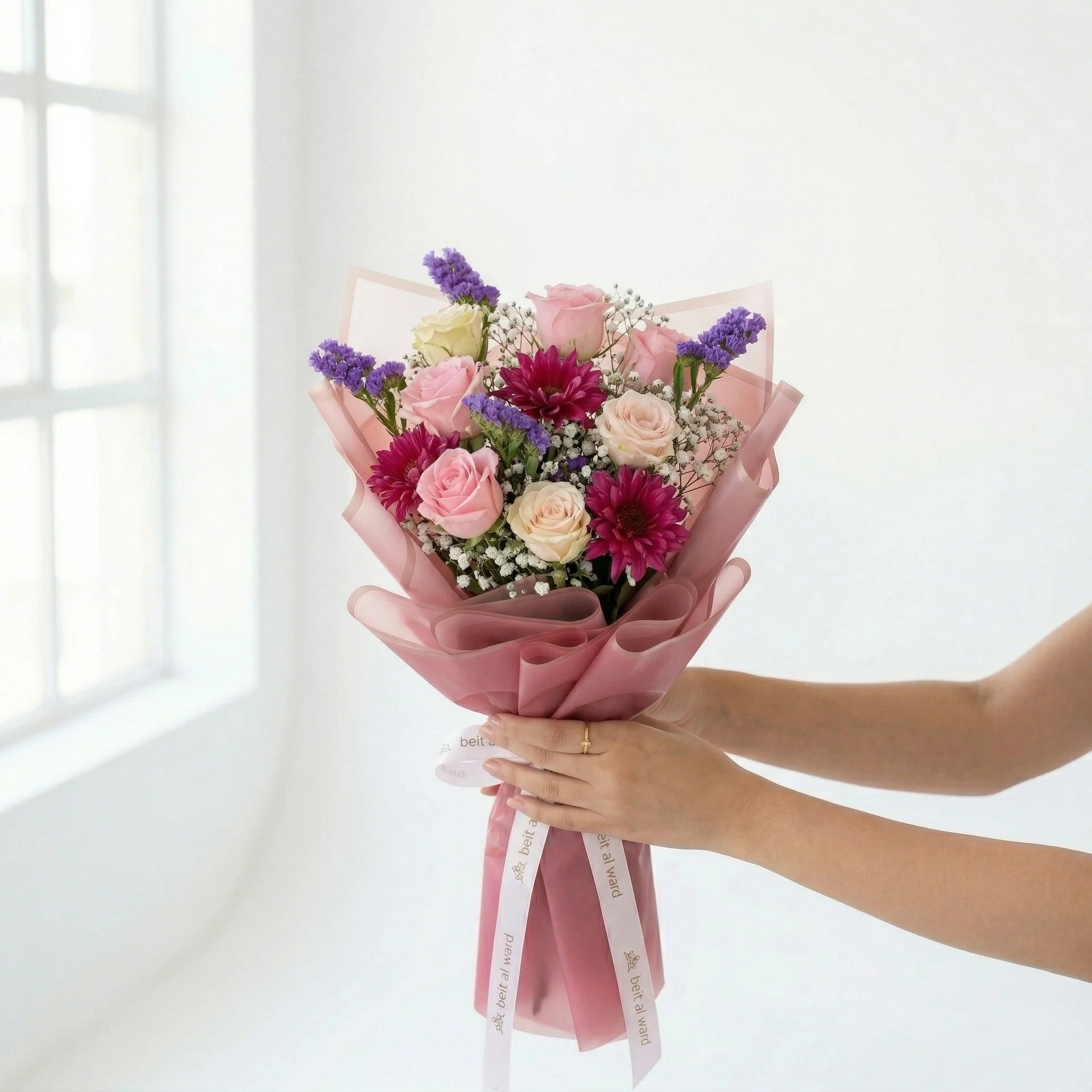 Princesa luxury pink flower bouquet with roses and fresh seasonal flowers wrapped in blush paper by Idole Lebanon
