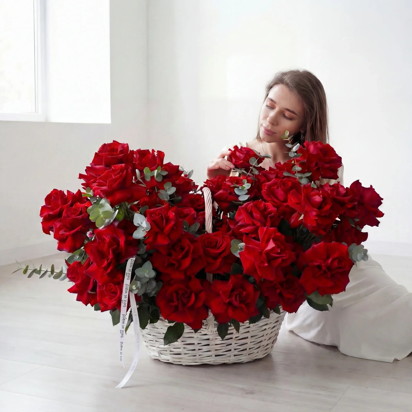 Large basket of fresh red roses with greenery for romantic occasions in Lebanon by Beit El Ward