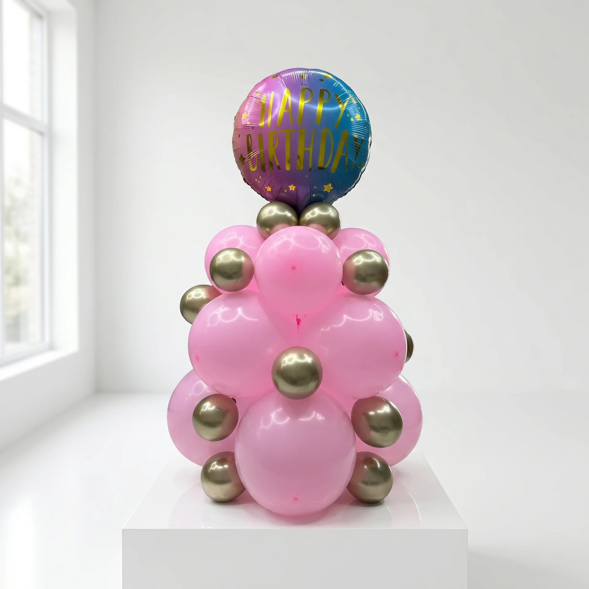 Pink Tower birthday balloon arrangement with pink and gold balloons for delivery in Lebanon by Idole Lebanon
