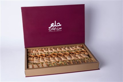 Luxury Lebanese baklava assortment in premium book-style gift box by Douaihy Sweets
