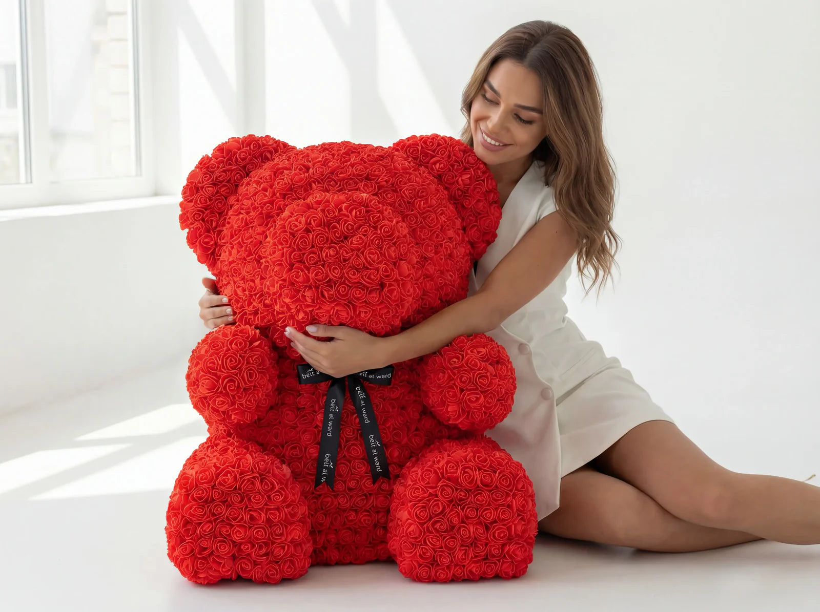 Large red rose teddy bear gift held by woman perfect romantic gift in Lebanon