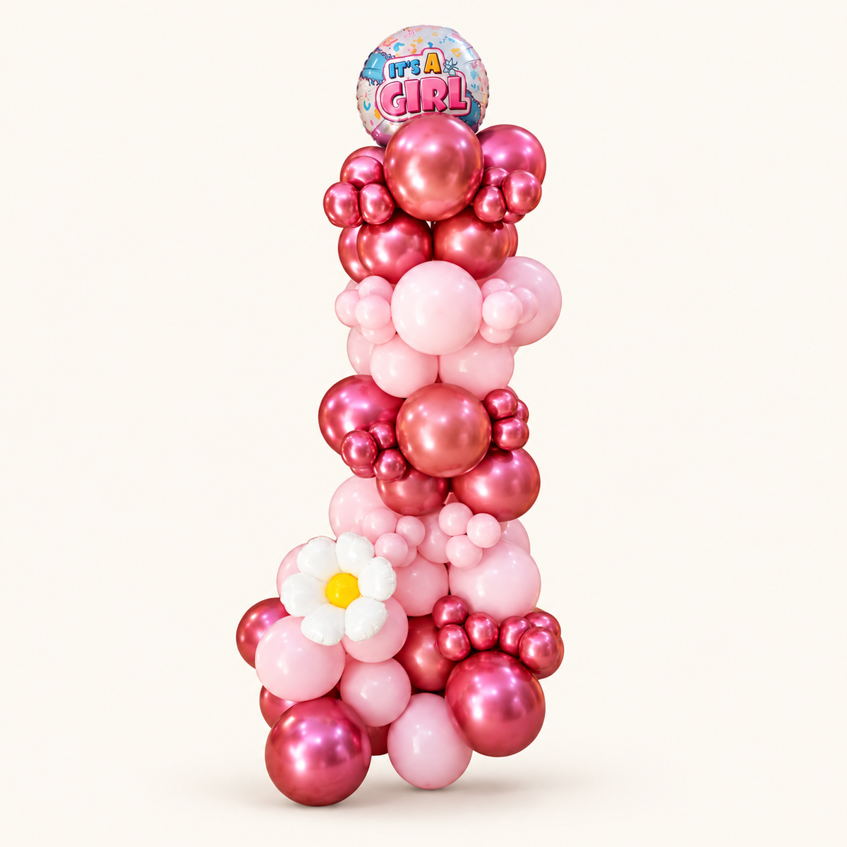 Pink and metallic rose-pink balloon column with a white daisy, yellow centre and an It's a Girl foil topper.