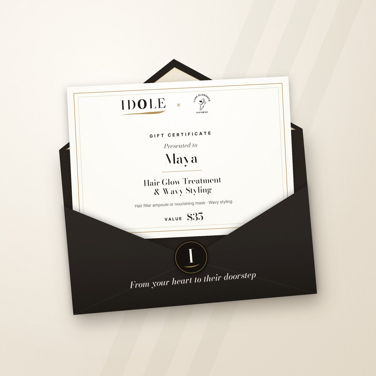 Idole × Luxe Elegance gift certificate for a Hair Glow Treatment & Wavy Styling, $35, in an espresso Idole envelope with monogram seal