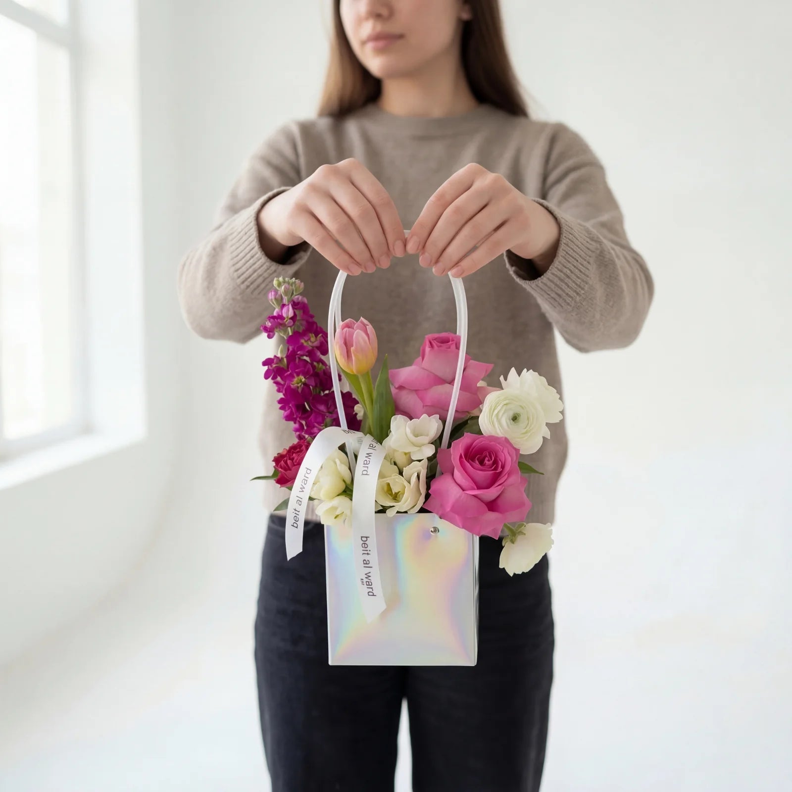 Small pastel flower arrangement in bag with mixed fresh flowers Beirut Lebanon