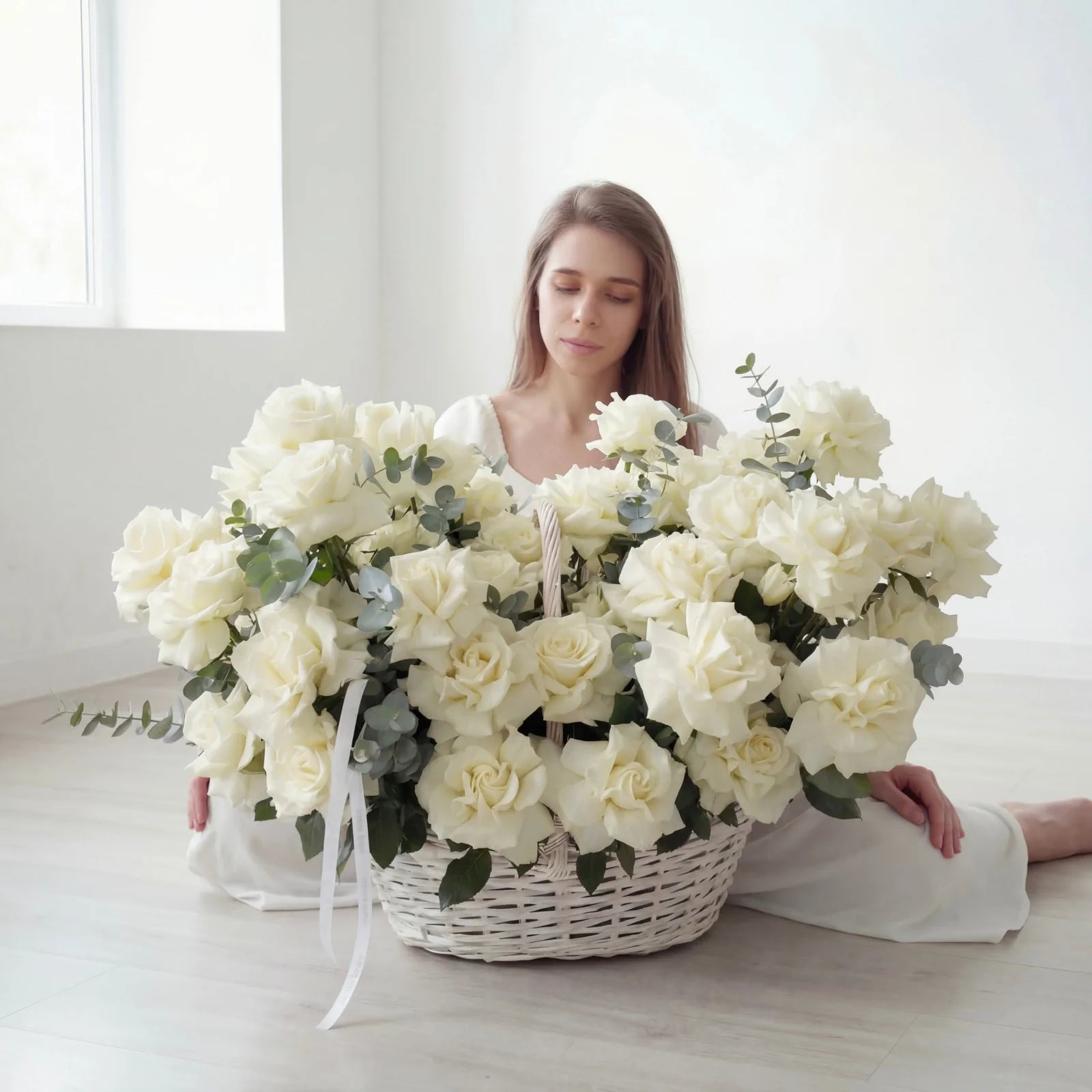 Basket of white roses with greenery elegant flower arrangement for weddings and sympathy in Lebanon