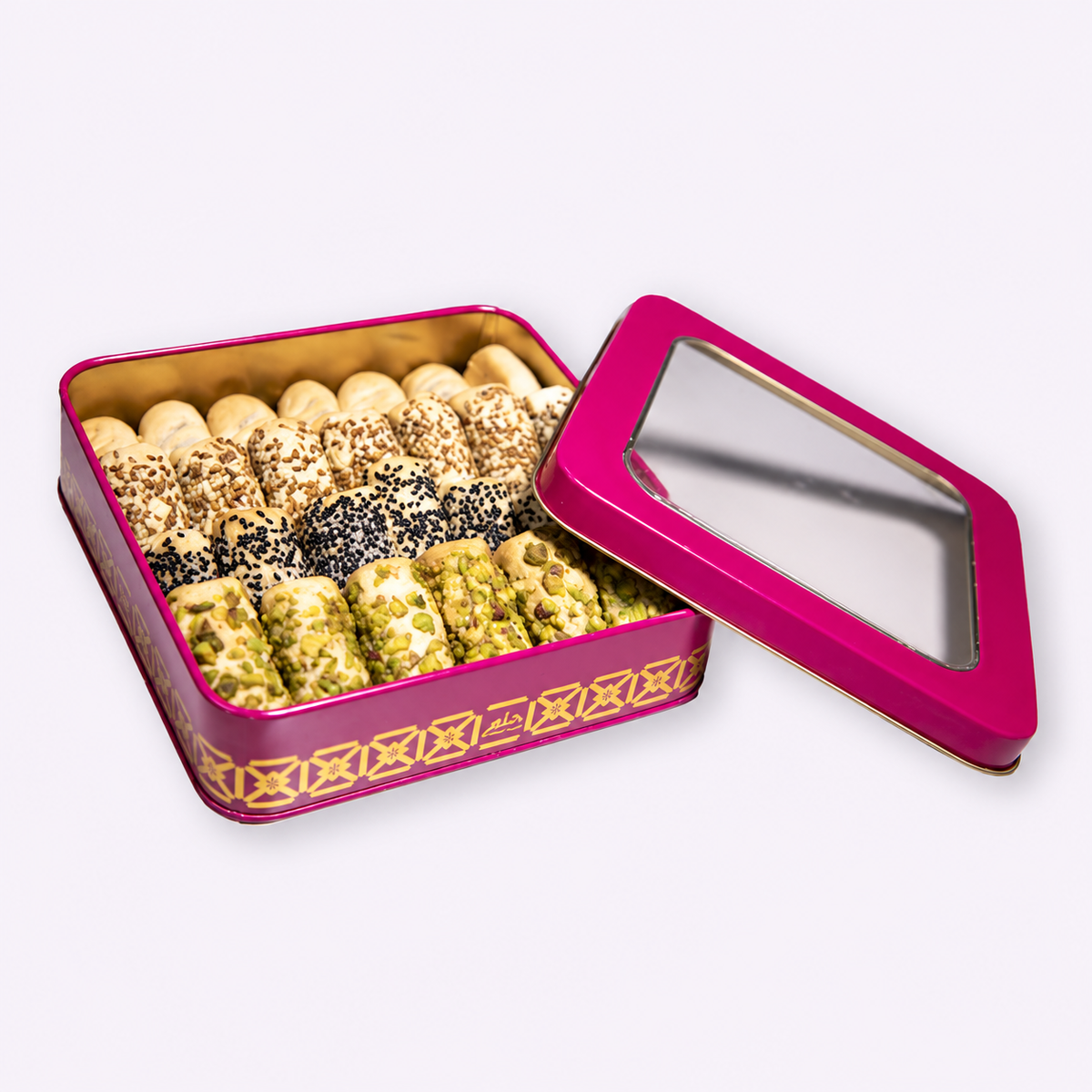 Douaihy Tamriate ~ 35pcs. Assorted date pastries with seed and pistachio coatings in a pink and gold tin.