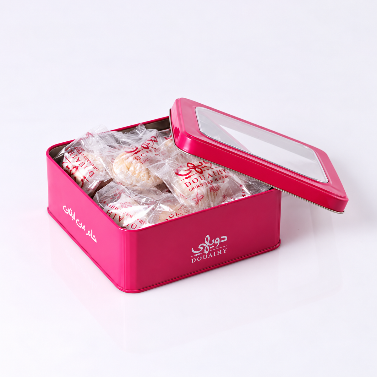 Douaihy Maamoul Walnuts Packed ~ 15pcs. Individually wrapped walnut maamoul in an open pink tin.