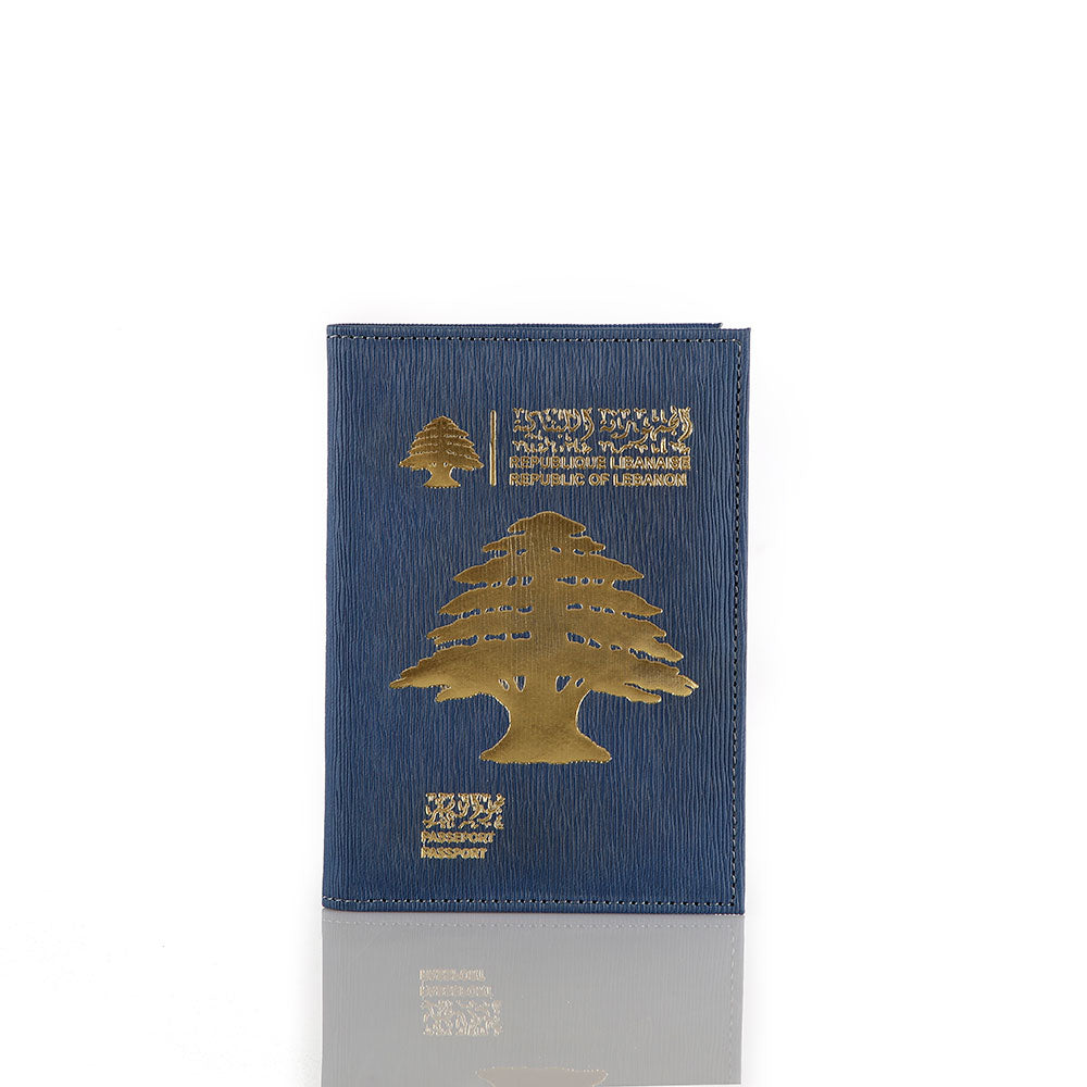 Blue Lebanon passport holder with gold cedar tree design, vegan leather travel accessory made in Lebanon.