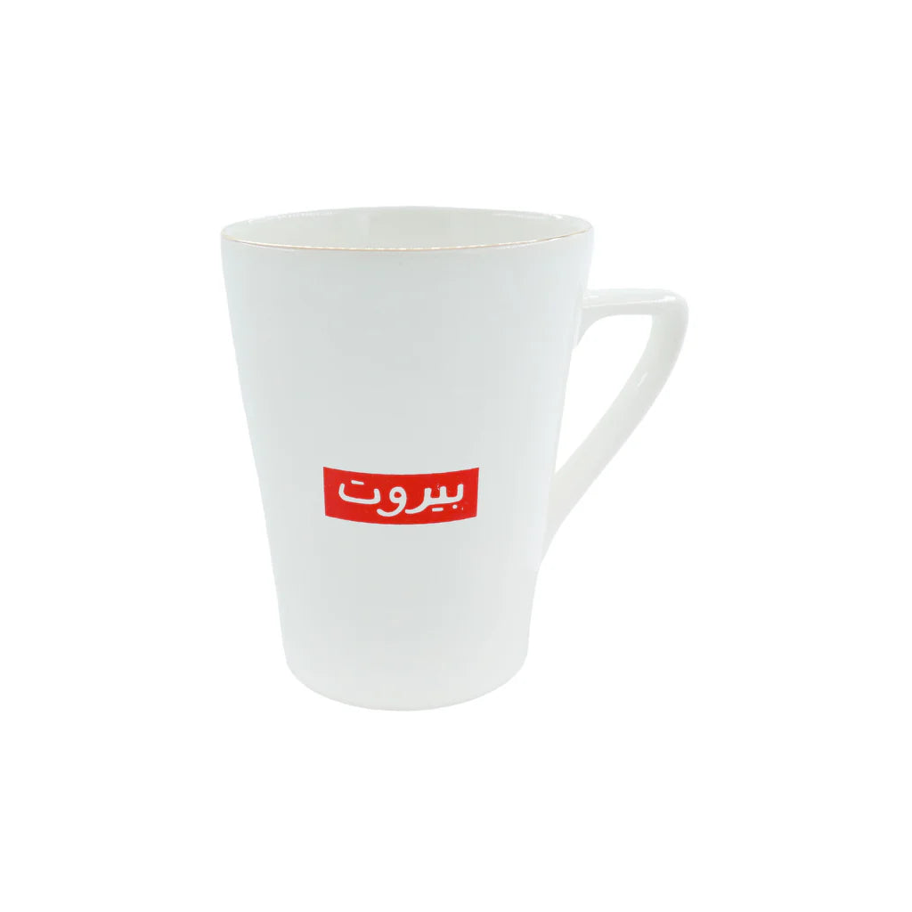 White porcelain mug with red Beirut typography and minimalist modern design