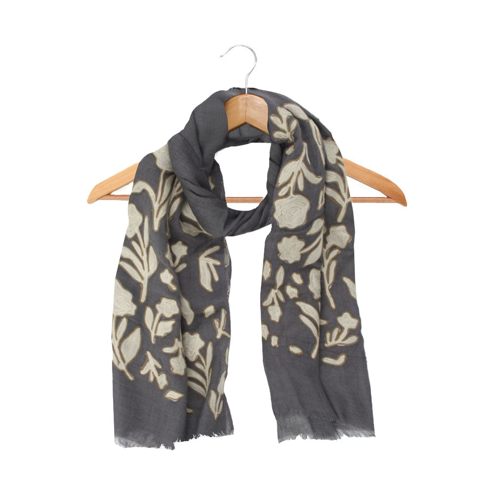 Grey wool scarf with beige floral pattern by Mouftah El Chark, elegant neutral winter accessory at Idole Lebanon