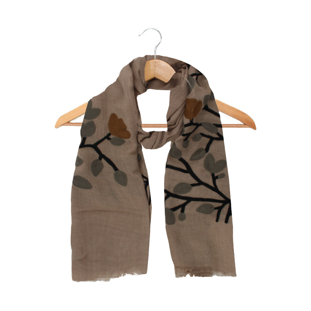 Beige wool scarf with leaf and floral pattern by Mouftah El Chark, elegant neutral accessory at Idole Lebanon