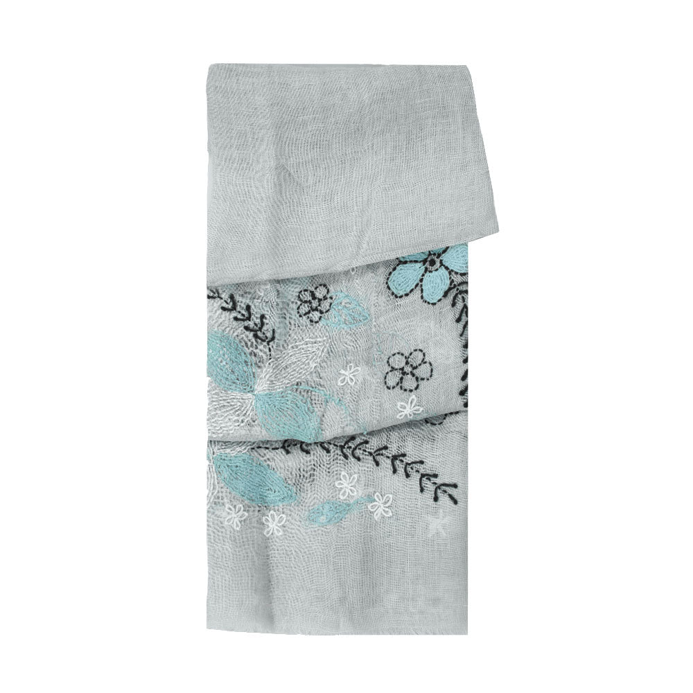 Grey linen scarf with blue and white floral pattern by Mouftah El Chark, elegant lightweight summer accessory at Idole Lebanon