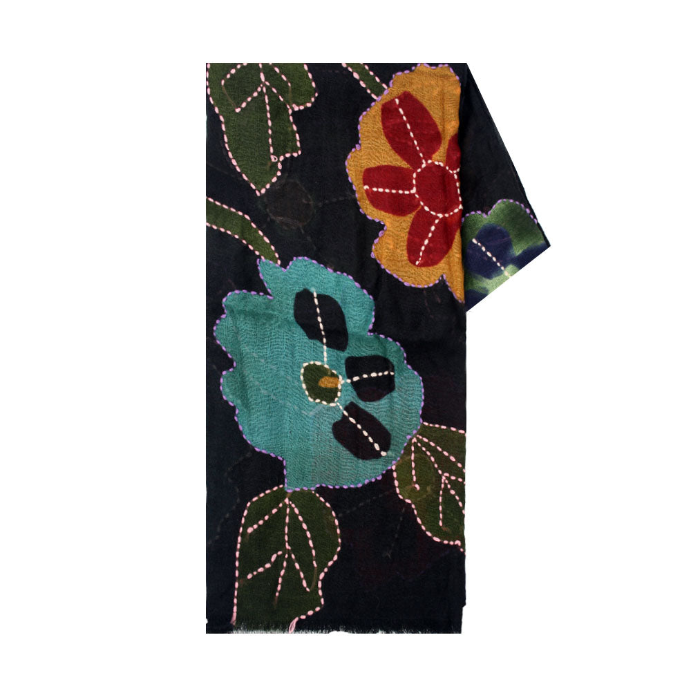 Black wool scarf with colorful floral pattern by Mouftah El Chark, bold elegant winter accessory at Idole Lebanon
