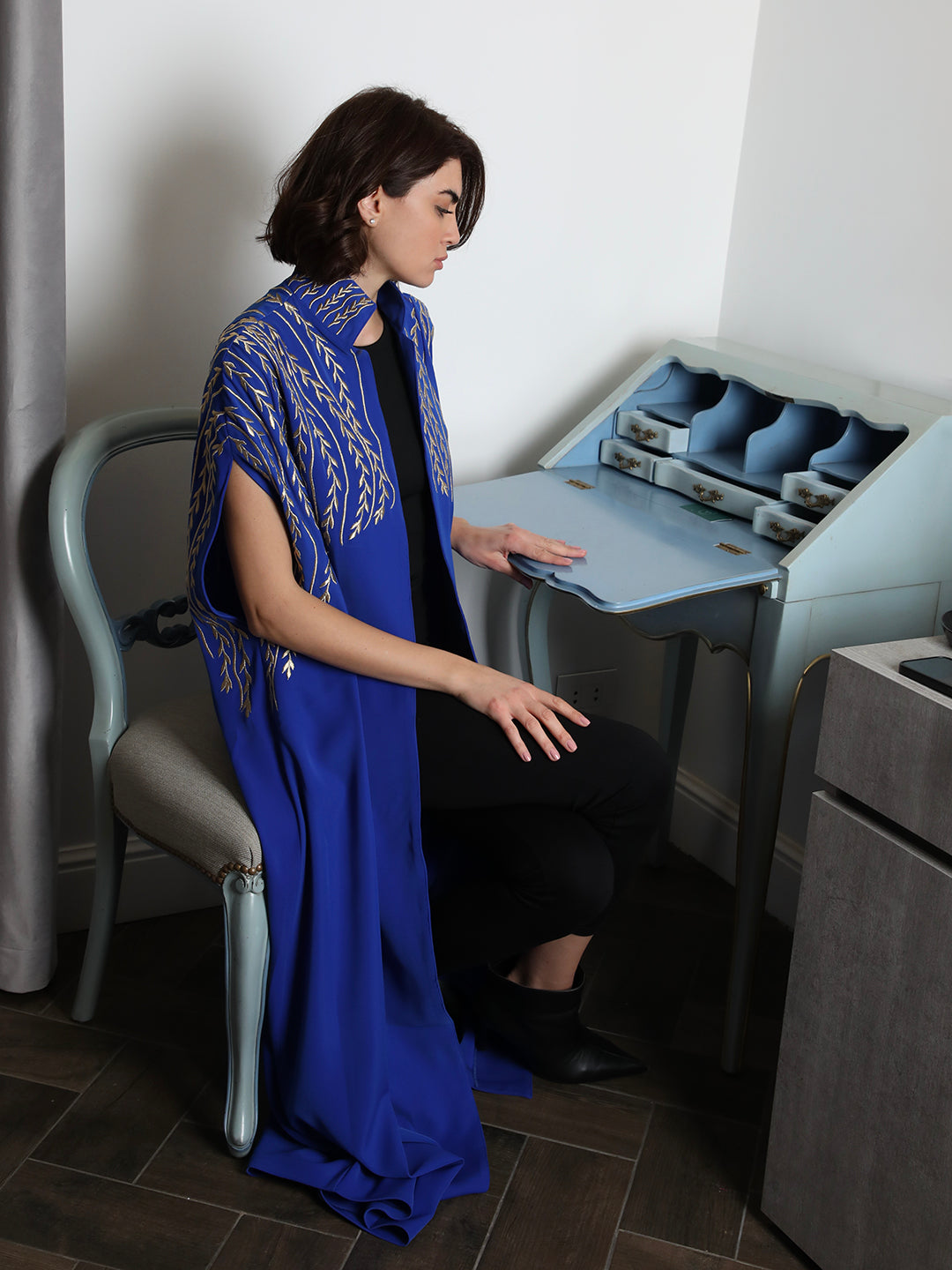 Blue embroidered abaya with gold leaf design by Mouftah El Chark, elegant modest wear for women at Idole Lebanon