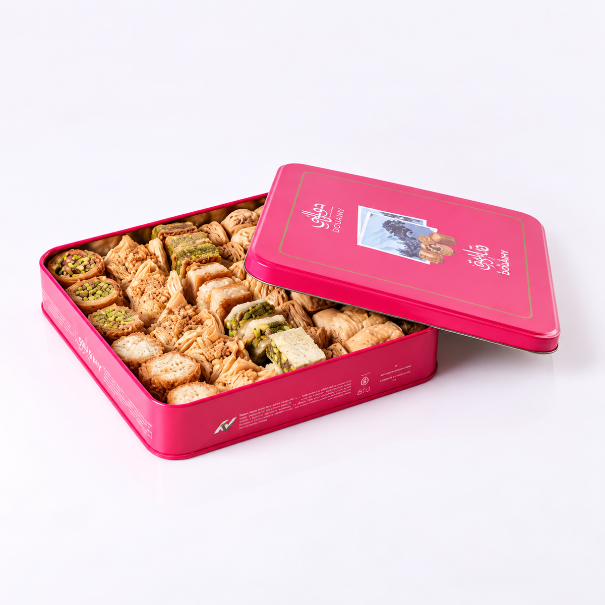 Douaihy Assorted Baklava ~ 40pcs. Assorted baklava in an open pink tin with illustrated lid.