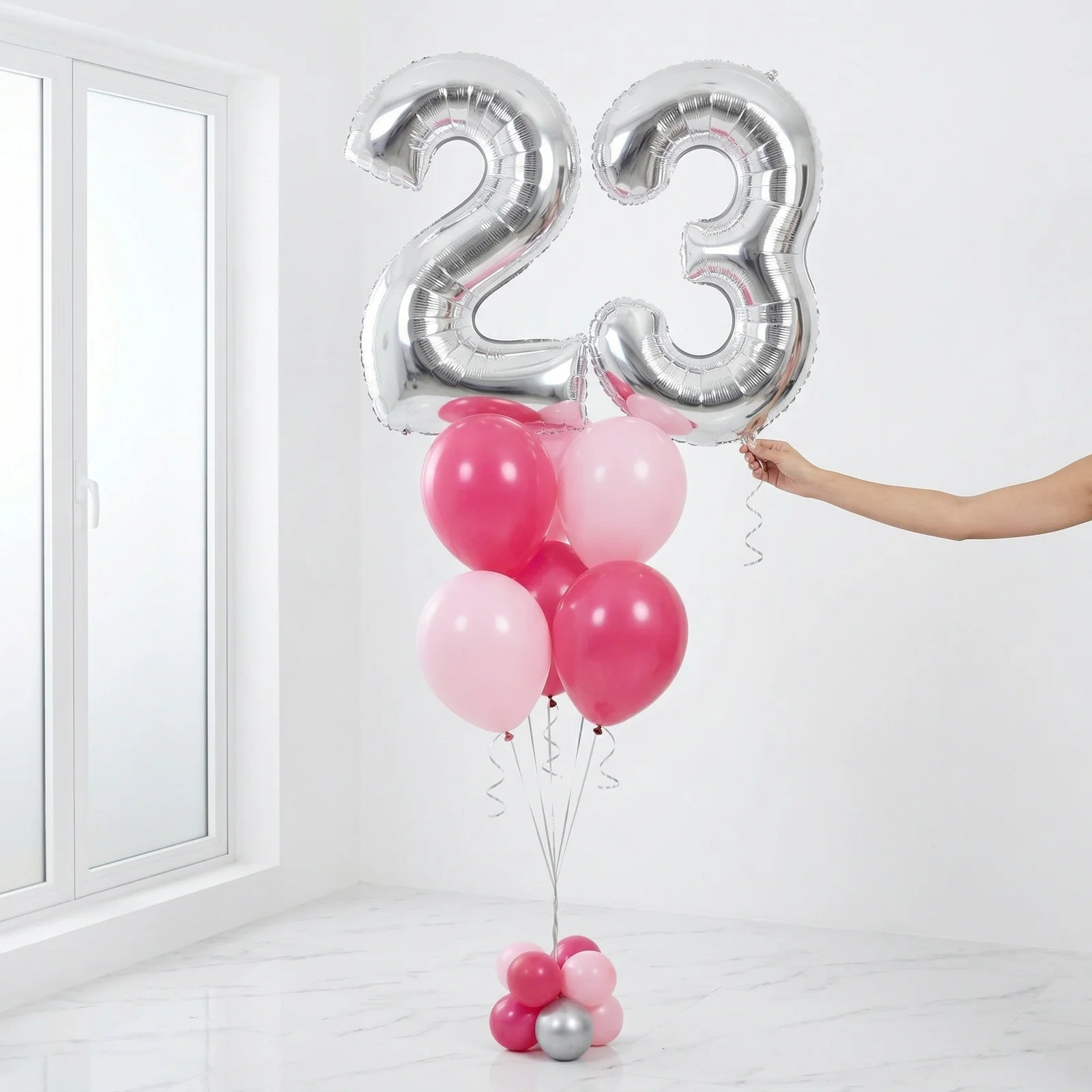 Silver number balloons with pink helium balloons bouquet for birthday celebration in Lebanon
