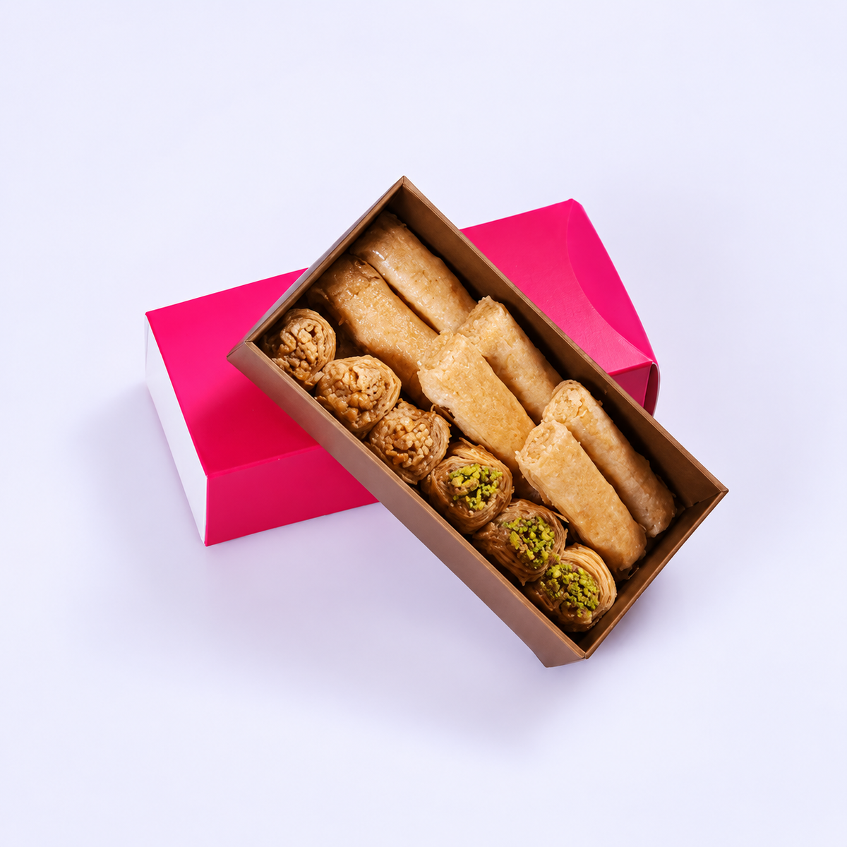 Douaihy Sweets Bar ~ 11pcs. Assorted pastries in a small gold tray with pink sleeve.
