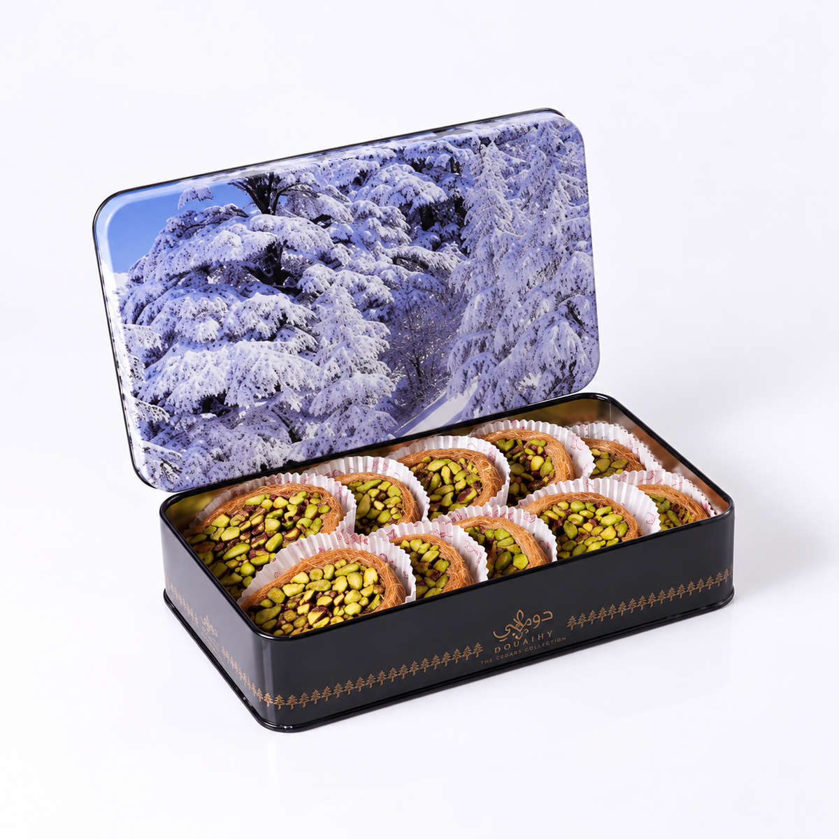 Douaihy The Cedars Collection ~ 10pcs. Pistachio-filled pastries in an open tin with snowy cedar artwork on the lid.