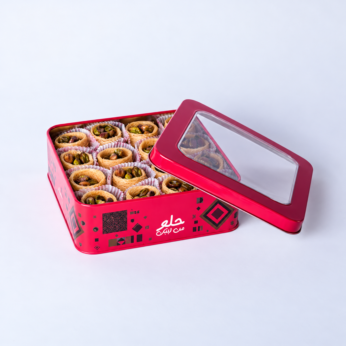 Douaihy Ich El Bilbol ~ 32pcs. Pistachio-filled pastry nests in a pink windowed tin.