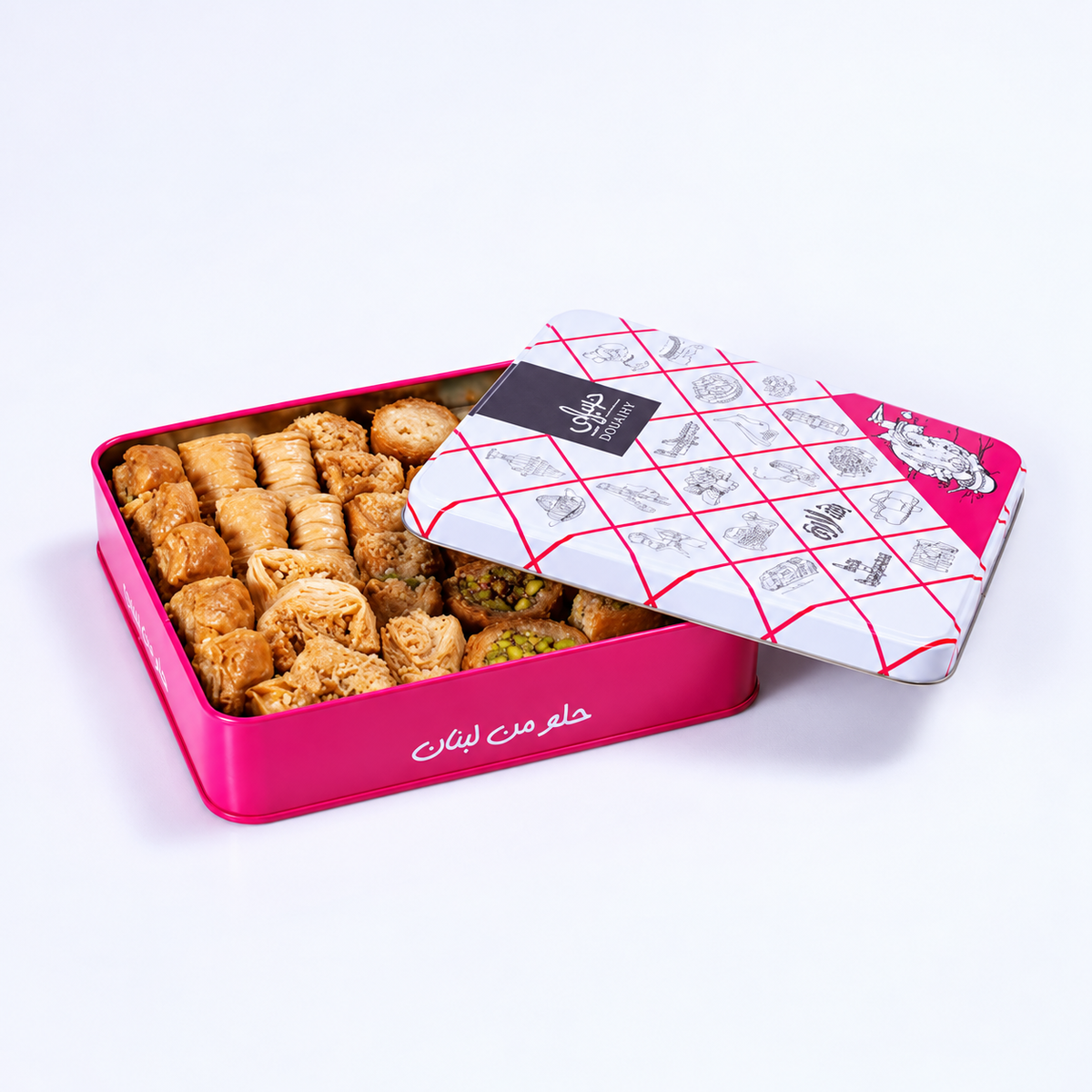 Douaihy Assorted Baklava Touristic Tin ~ 34pcs. Assorted baklava in a pink tin with patterned touristic lid.