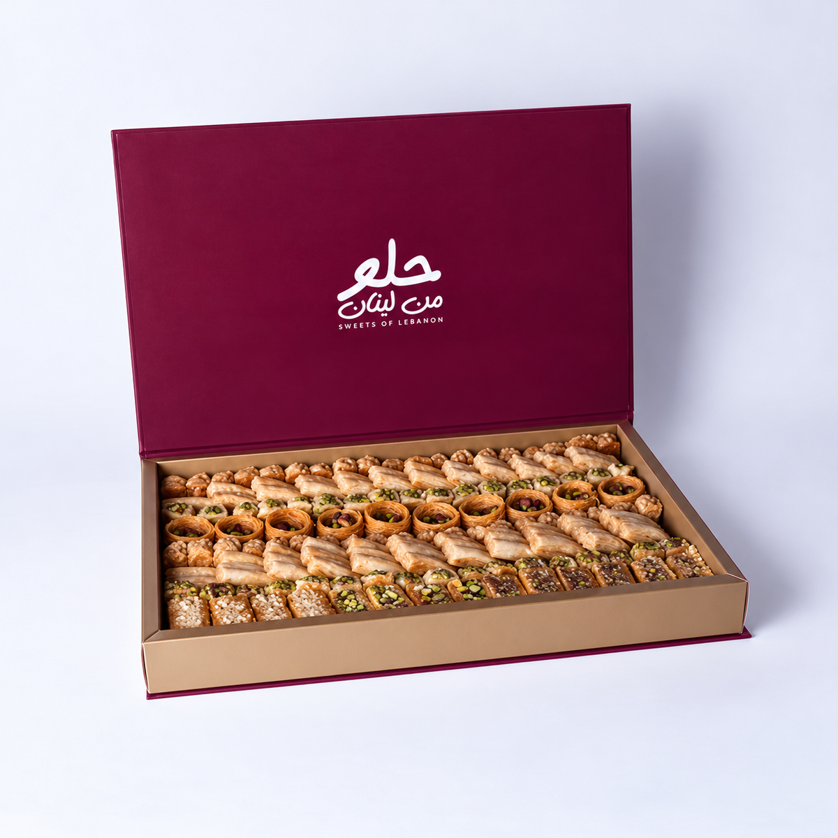 Douaihy Premium Book Gift Large ~ 125pcs. Assorted baklava in a large gift box with burgundy lid.