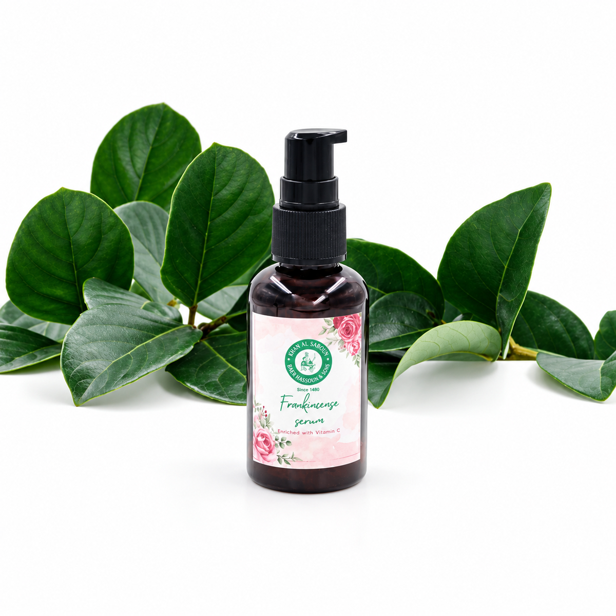 Khan Al Saboun Frankincense Vitamin C Serum – 50ml. Dark pump serum bottle with floral label and green leaves.