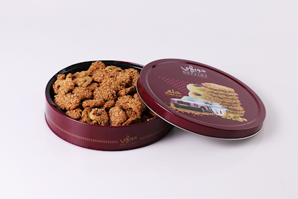 Round tin filled with traditional Lebanese Barazek cookies by Douaihy Sweets
