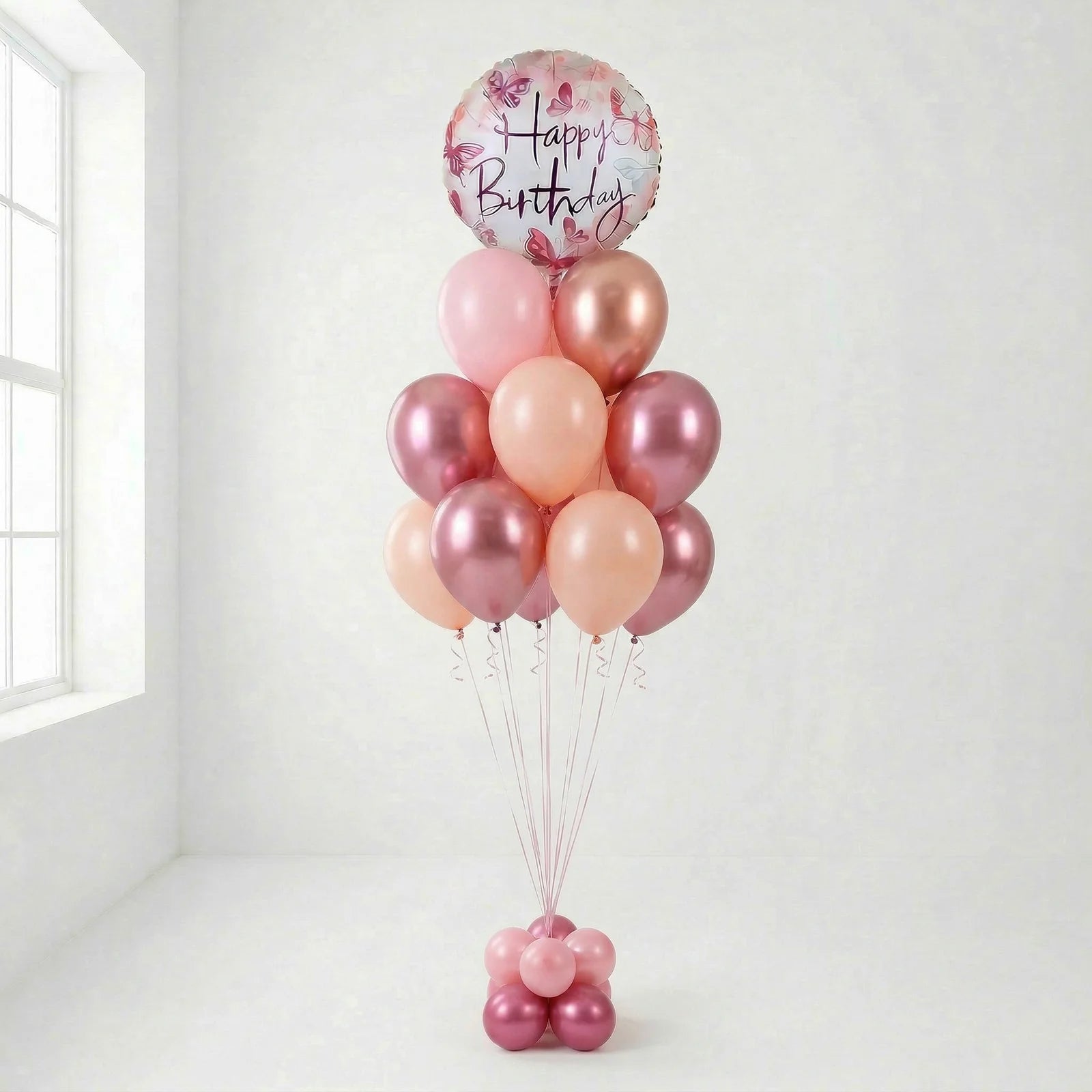 Pink and rose gold helium balloon bouquet with happy birthday balloon for celebrations in Lebanon
