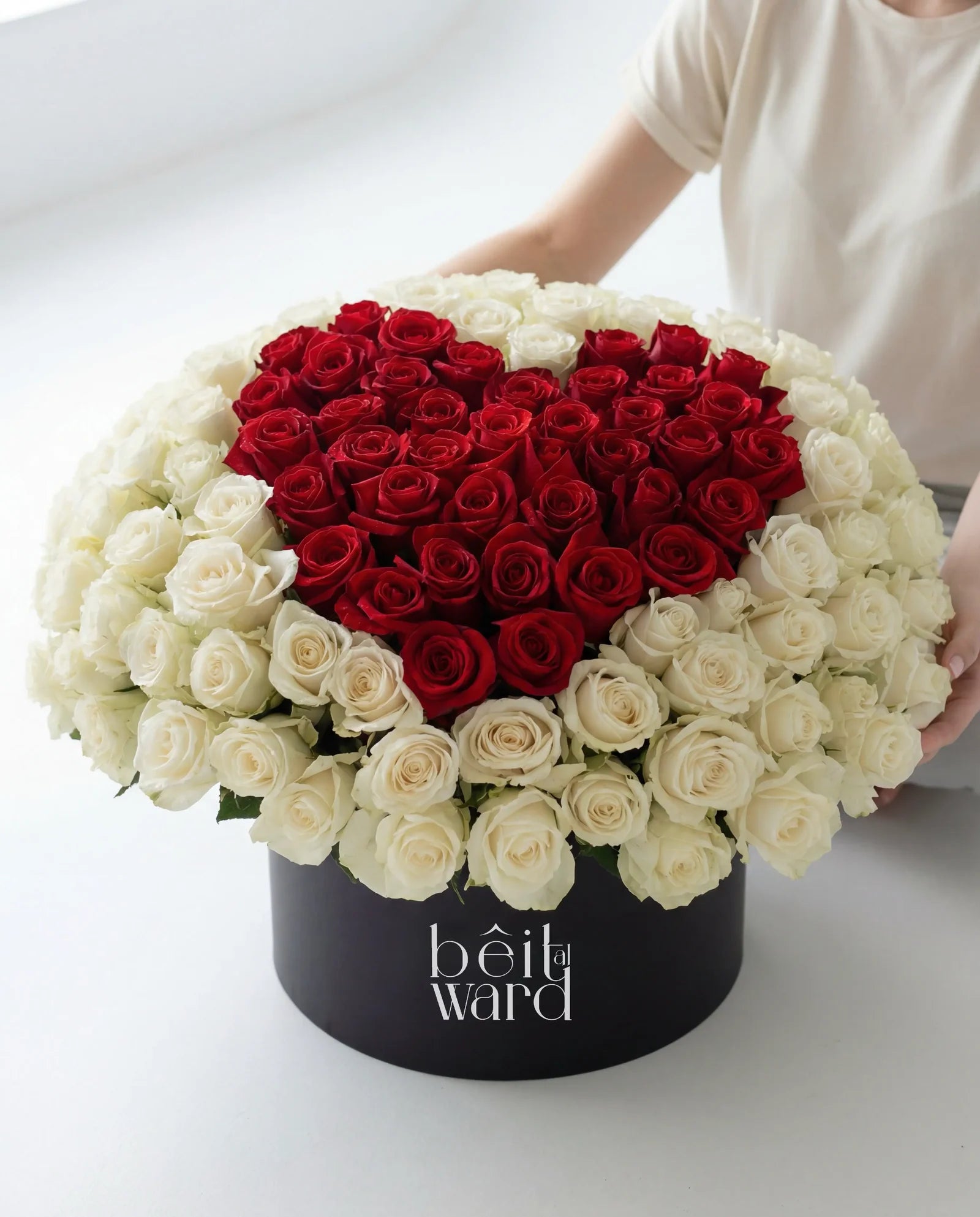 Heart-shaped red roses surrounded by white roses arrangement by Beit El Ward Lebanon