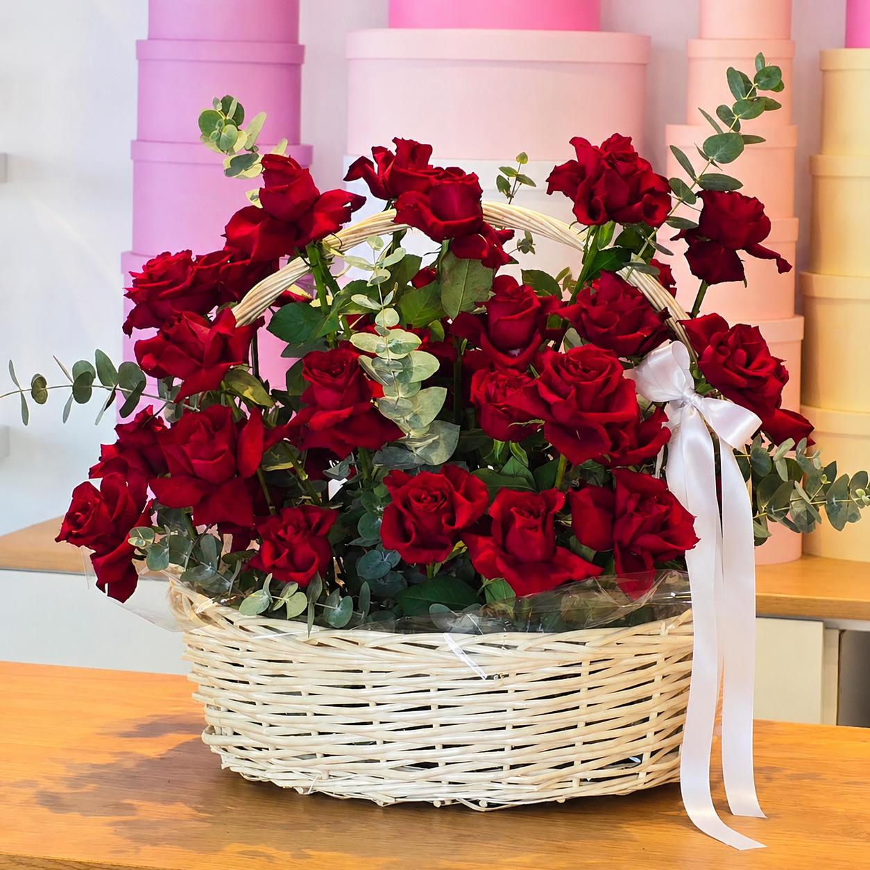 Luxury basket arrangement of 50 premium red roses with eucalyptus and white ribbon by Idole Lebanon