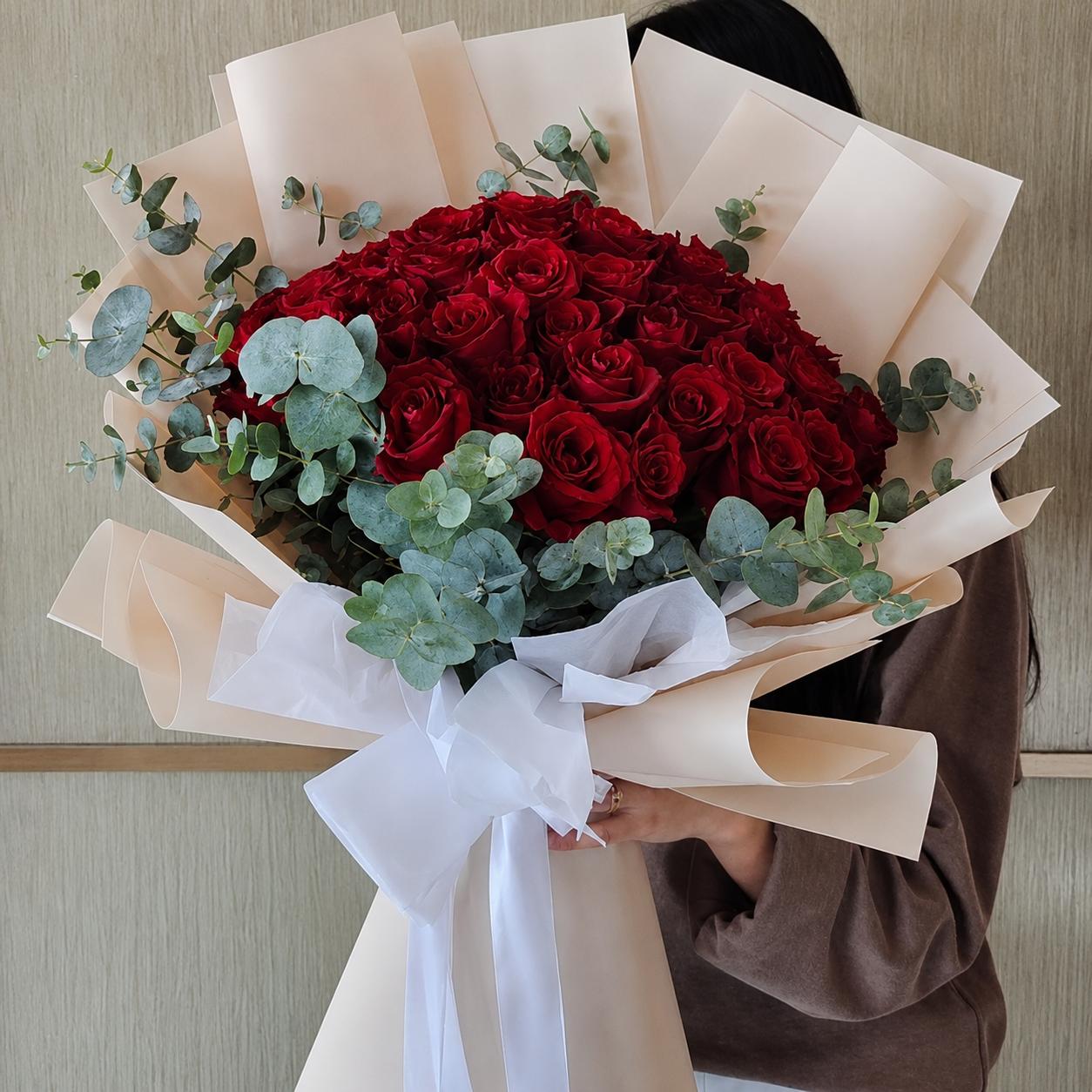 Luxury bouquet of 50 premium red roses with eucalyptus and elegant wrapping by Idole Lebanon