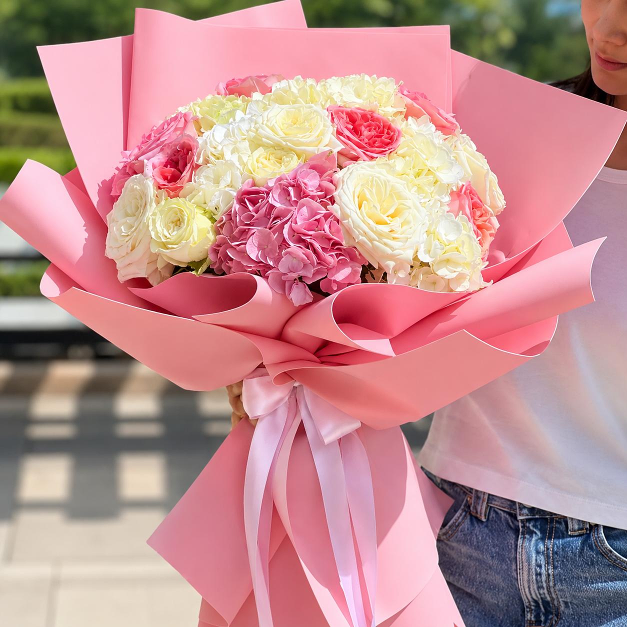 Luxury bouquet of pink hydrangeas with white and pink roses wrapped in elegant pastel pink paper by Idole Lebanon