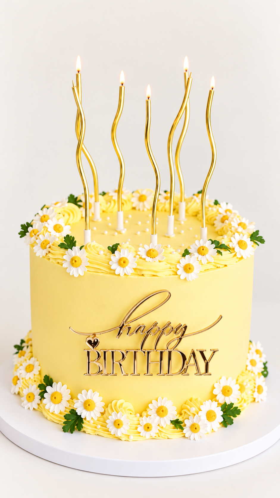 Yellow daisy birthday cake with candles and Happy Birthday decoration